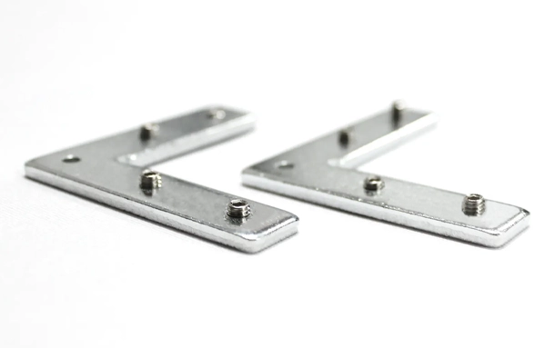 Two silver metal L-shaped brackets with small bolts on a white background.