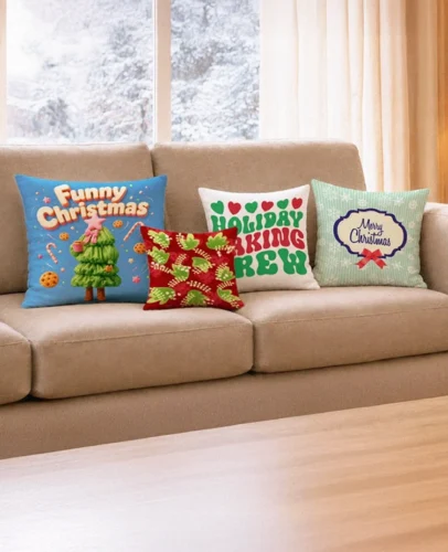 Beige sectional sofa with colorful Christmas-themed throw pillows on a windowed wall.